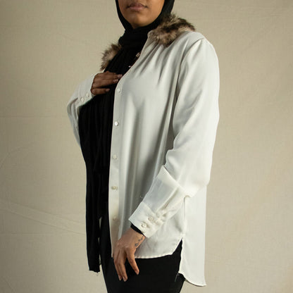Sheer button up blouse with faux fur detail.
